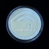 Linkziel: Link zum Beitrag mit dem Thema ThüringenForst-Medaille; Bildinhalt: Vorderansicht einer Silbermünze mit Prägung des ThüringenForst-Logos